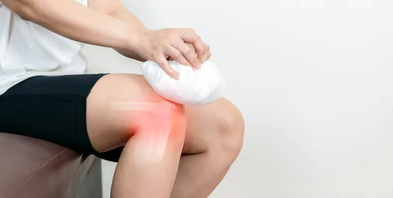 Close-up of a knee joint exam during a regenerative medicine consultation in Portsmouth, NH