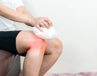 Close-up of a knee joint exam during a regenerative medicine consultation in Portsmouth, NH